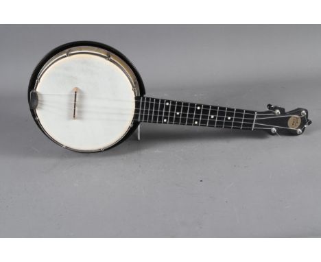 A contemporary Jolli-Joe four-string banjolele with black gilt sparkle finish, 21" long 