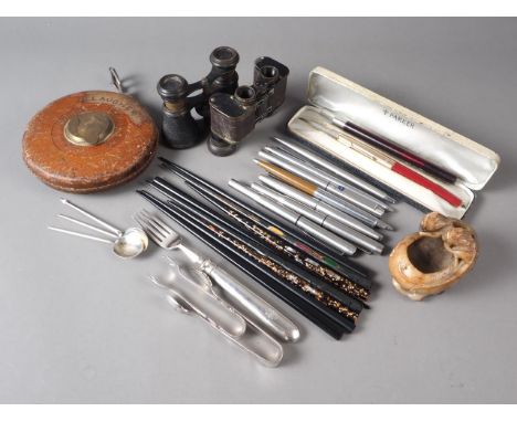 A quantity of ball point and other pens, a boxed Parker pen, three silver coffee spoons, chopsticks, two pairs of opera glass