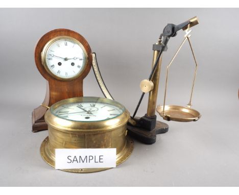 A brass cased bulkhead clock with later movement, 9 1/2" dia, an Edwardian mahogany and line inlaid balloon-shaped clock, 12 