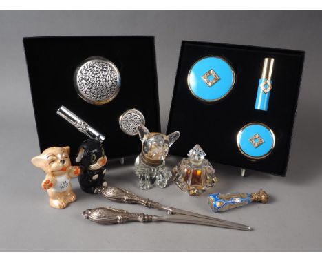 A Victorian overlaid cut glass desk seal, a pair or silver glove stretchers, an inkwell, formed as a bulldog, a scent bottle,