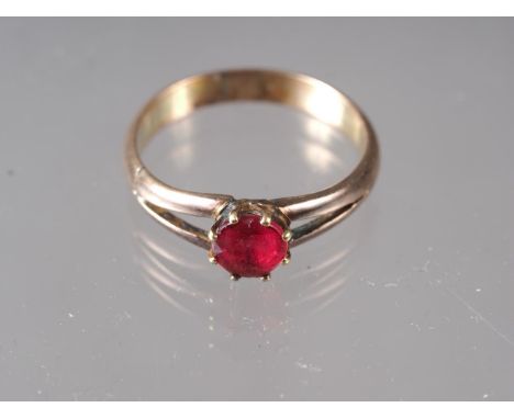 A yellow metal ring, set single ruby, size P, 3.1g 