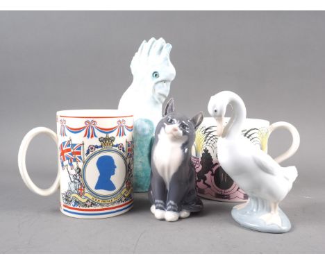 A Wedgwood 1953 commemorative mug, designed by Eric Ravilious, a Royal Copenhagen model of a cat, No 1803, 5 1/4" high, anoth