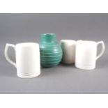 A Keith Murray Wedgwood bulbous green glazed vase with line design, 6 1/4" high, and three Keith