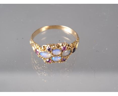 A Victorian yellow metal, opal and ruby dress ring, size L, 1.9gCondition:Ring is slightly misshapen and in need of a good cl