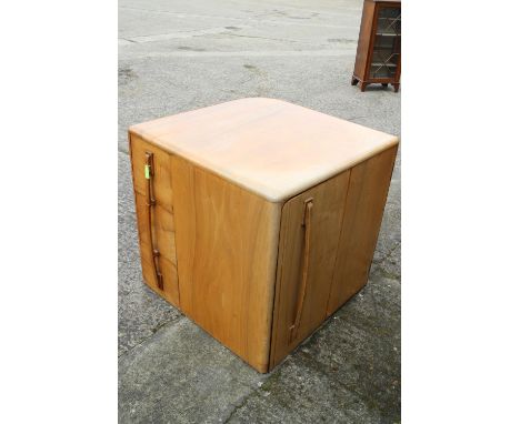 A 1930s walnut metamorphic cube desk, fitted three doors, concealed kneehole and three open corner shelves, 29 1/2" wide x 30