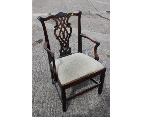 A Georgian provincial carver chair of Chippendale design with drop-in seat, on stretchered supportsCondition:Joints are sligh