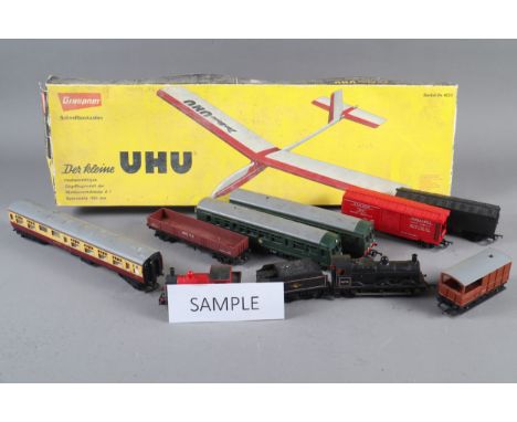 A Tri-ang railways locomotive and other rolling stock and accessories, the UHU balsa wood and paper glider model, for home as