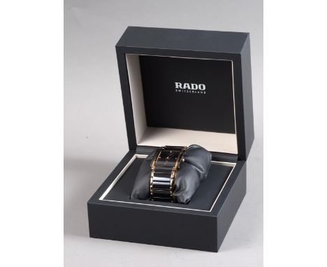 A gentleman's Rado wristwatch, set four diamonds, in original box with spare link, guarantee cards and instructions