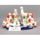 A quantity of 19th century and later Staffordshire models, including spaniels, greyhounds, etc (some
