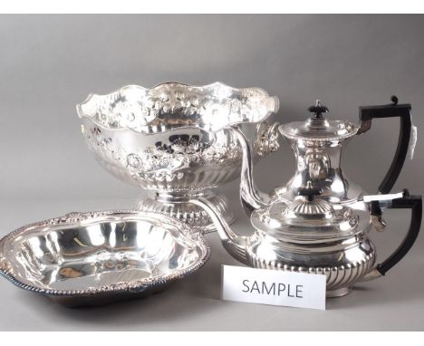 A silver plated punch bowl, a pair of plated trays, a ham stand and other plate 