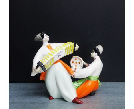 A Russian porcelain figure of an accordion player and tambourine player, 18cm high
