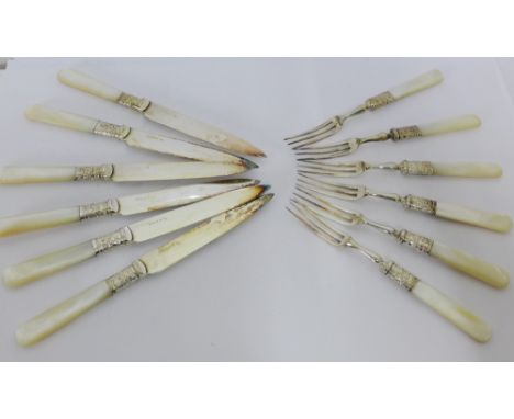 A set of mother-of-pearl handled and Epns foliate engraved fruit knives and forks, six place setting