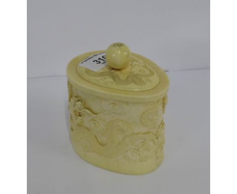 An early 20th century ivory carved pot and cover with Dragon and Pearl of Wisdom pattern in relief with etched beetle mark to
