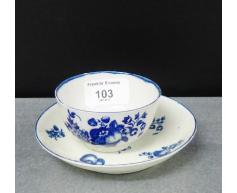 An 18th century Worcester blue and white teabowl and saucer in painted fruit pattern, (2) 