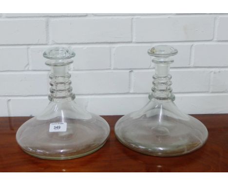 Two glass ships style ring necked decanter and stoppers, 22cm high 