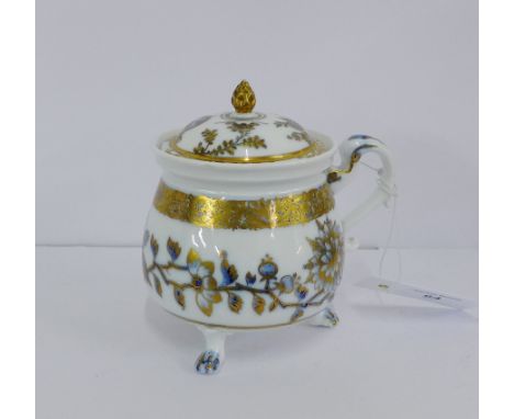 A Meissen porcelain 'Onion' patterned cream pot and cover, with ornate over gilding and acorn finial to the lid, on three paw