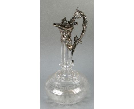 An Edwardian silver plated and glass claret jug with wheel engraved decoration, approx 29cms high.