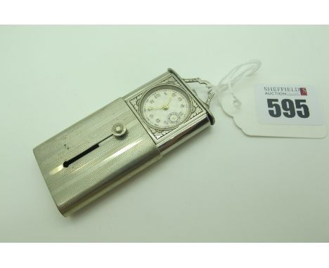 A Vintage Purse Watch, the chequered textured dial with Arabic numerals and seconds subsidiary dial, sliding within engine tu