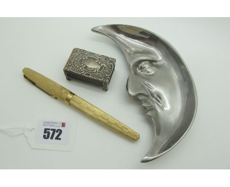 A Hallmarked Silver Matchbox Cover, leaf scroll decorated in relief, on ball feet; together with a novelty 'Staybrite' man in