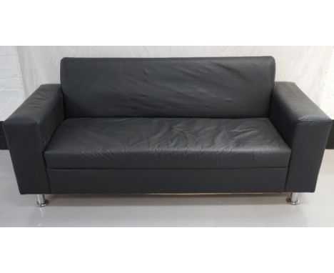 MODERN THREE SEATER SOFA
in black simulated leather standing on polished steel supports, 200cm wide