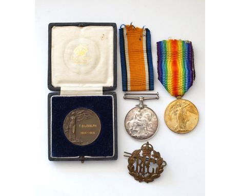 1914-18 BRITISH WAR AND VICTORY MEDALS
named to '401486. 2. A.M. T.C.Biddulph. R.F.C.', together with a 'RFC' cap badge and b