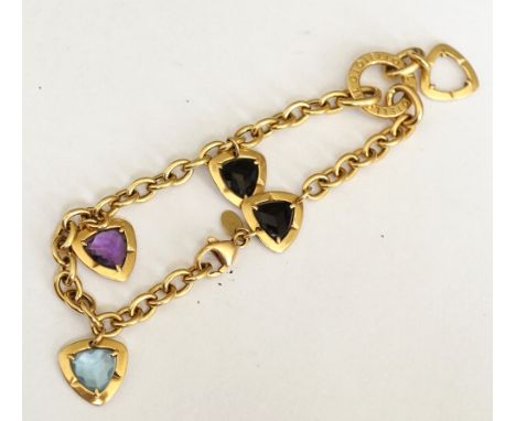 IL GIOIELLO EIGHTEEN CARAT GOLD AND GEM SET CHARM BRACELET
set with aquamarine, amethyst and sapphire, total weight approxima