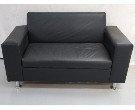 MODERN TWO SEATER SOFA
in black simulated leather standing on polished steel supports, 153cm wide