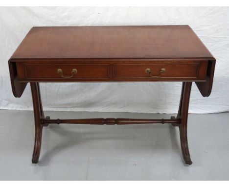 MAHOGANY SOFA TABLE
with two brass handled drawers to one side and matching false drawer front to opposing side, raised on sh