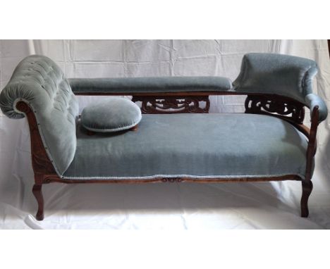 VICTORIAN DAYBED
with a raised shaped button back and carved decoration, standing on cabriole supports, 165cm wide, together 