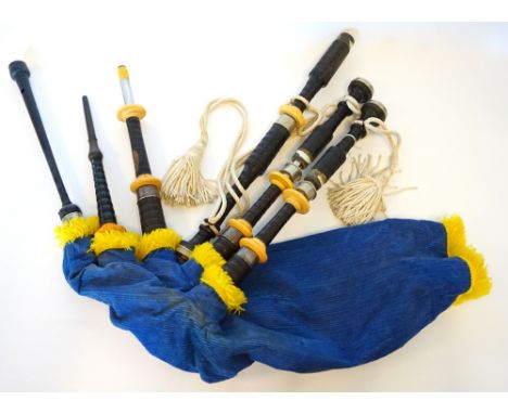 SET OF 'HENDERSON' BAGPIPES
with turned rosewood drones with ivorine mounts, a synthetic bag with a blue corduroy cover, an e