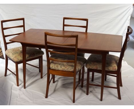 A.H.MCINTOSH & CO LTD TEAK SUITE OF FURNITURE
comprising an extending dining table with concealed fold out flap, standing on 