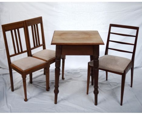 EDWARDIAN MAHOGANY SQUARE TOP SIDE TABLE
standing on turned tapering supports, 56cm wide; together with a pair of light oak 1