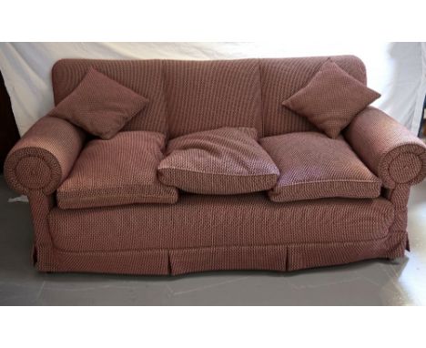 LATE 19th CENTURY DROP END SOFA
with loose seat cushions, standing on turned front supports with brass castors, 200cm wide