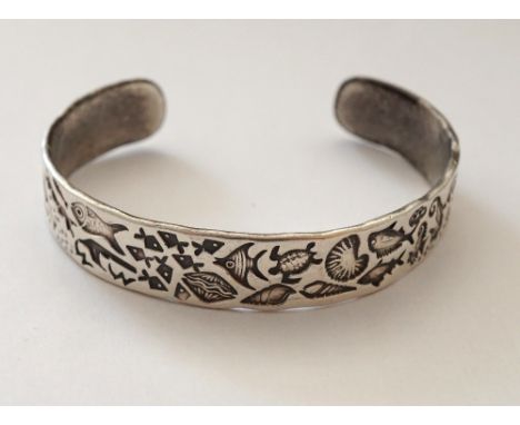 MODERN DESIGNER SILVER BANGLE
decorated with marine life including various fish, shells, jelly fish, turtle and diver, dated 