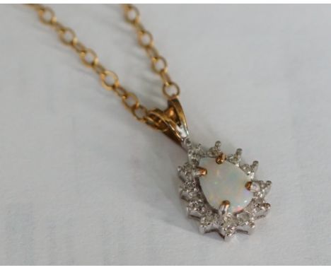 OPAL AND DIAMOND CLUSTER PENDANT
in nine carat gold and on nine carat gold chain; together with a pair of amethyst cluster dr