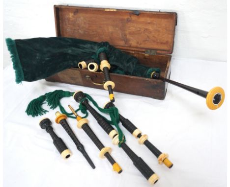 SET OF 'R G HARDIE' OF GLASGOW BAGPIPES
with turned rosewood drones and ivorine mounts, the leather bag with a green velvet c
