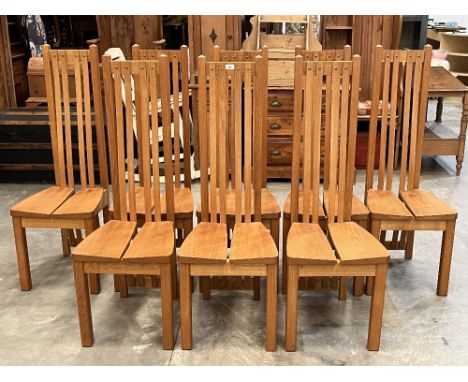 A set of eight light oak dining chairs in the manner of Charles Rennie Mackintosh, made by Adam Bunning of Bridgnorth.