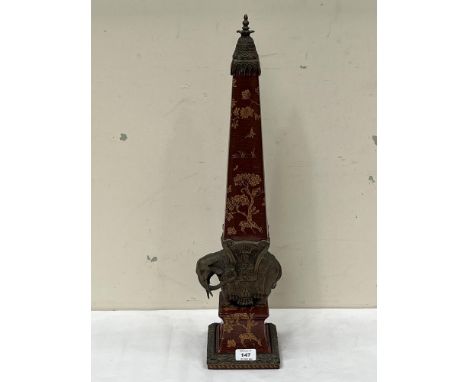 A porcelain and bronze obelisk by Wong Lee after the monument in the Piazza della Minerva, Rome. 25" high.