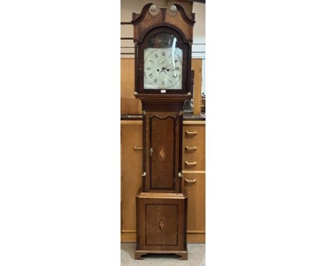 A George III oak and mahogany 8 day longcase clock, the painted break-arch dial faintly signed Wm. Payne, Ludlow. 86" high.