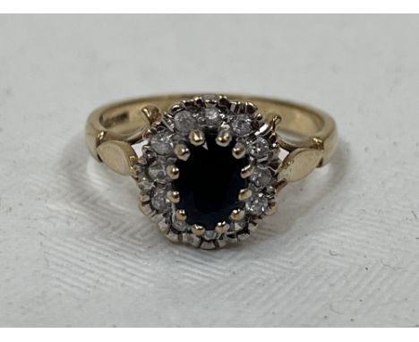 A 9ct sapphire cluster ring. 3g gross. Size N.