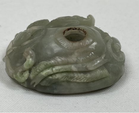 A Chinese archaistic jade water dropper, of pebble form and carved with crustacea. 2¼" long.
