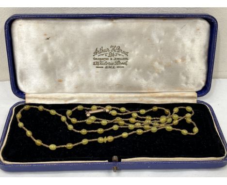 A necklace of jade beads with 9ct barrel clasp. 30" long approx.