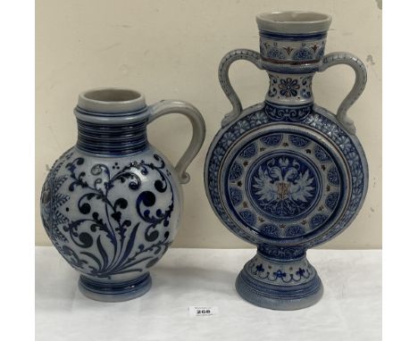 A German Rhenish salt glazed pottery moon flask, 15" high and a flagon.