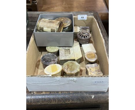Twelve carved soapstone trinket boxes and five other boxes.