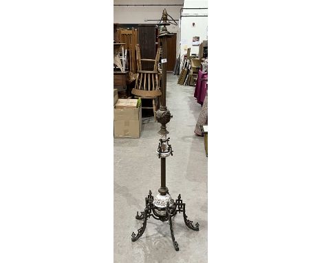 A brass and ceramic lamp standard.