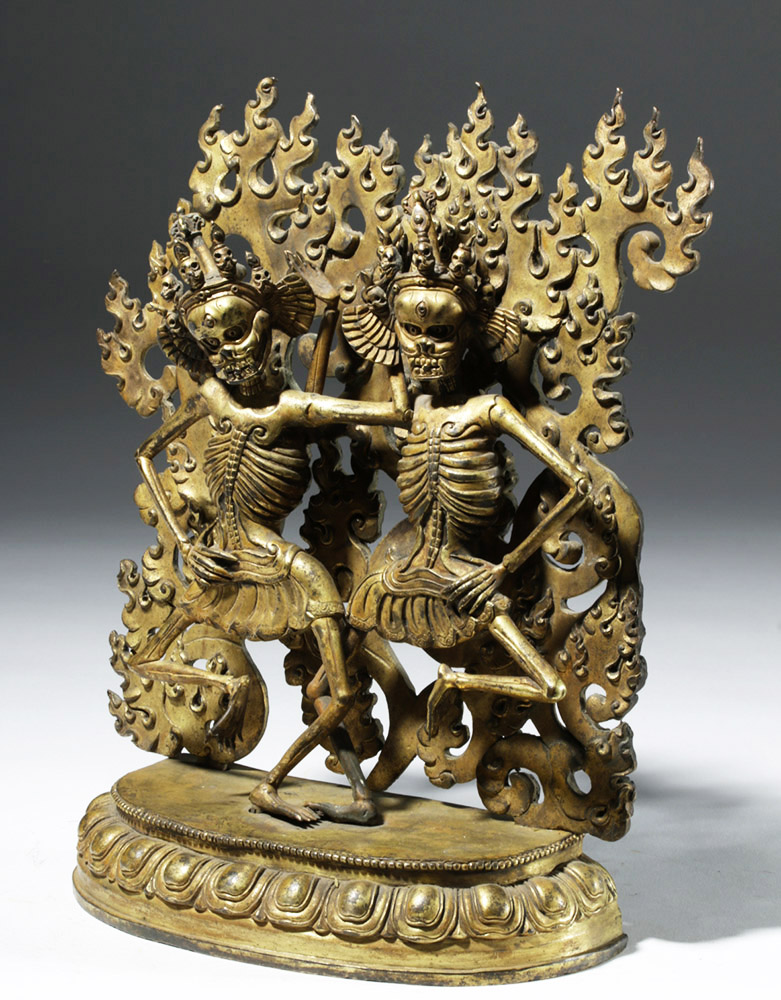 Tibet, ca. late 19th to early 20th century CE. A pair of gilded bronze ...