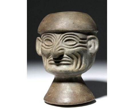 Pre-Columbian, Peru (North Coast), Moche Culture, ca. 100 to 700 CE. This is a striking blackware mold-made portrait stirrup 