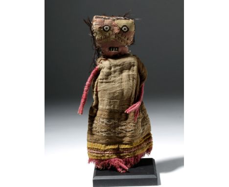 Pre-Columbian, Peru, Chancay or Chimu, ca. 1000 to 1400 CE. A lovely doll woven in cotton and camelid fibers, wearing a long 