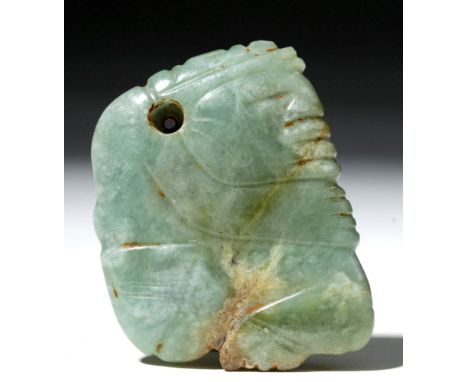 Pre-Columbian, Mexico or Guatemala, Mayan, ca. 6th to 9th century CE. This jade pendant features a carved view of a Mayan lor