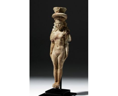 Egypt, Alexandria, 1st century BCE to 1st century CE. An alluring terracotta figure depicting the goddess Isis, standing in t